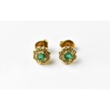 A pair of 18ct gold emerald and diamond flower cluster stud earrings,