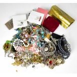 A collection of mixed vintage and modern costume jewellery to include necklaces, earrings, brooches,