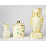 BELLEEK; three items of collectible porcelain to include an owl vase, height 21cm,
