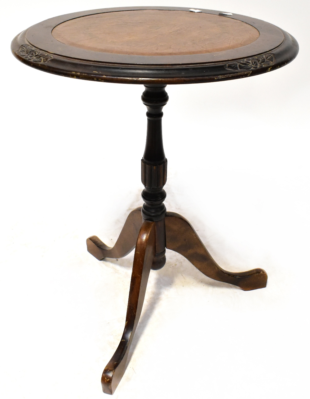 A 20th century mahogany leather-topped wine table on tripartite support, diameter 47cm,