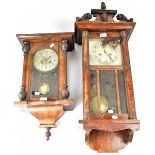 A Vienna-style regulator wall clock within a mahogany case,