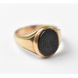 A 9ct gold gentlemen's signet ring with central oval bloodstone, carved with initials, size R,