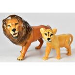 BESWICK; a model of a male lion facing left, 15 x 25cm, and a lion cub,