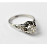 A diamond solitaire ring, the cathedral set brilliant cut diamond approx 0.