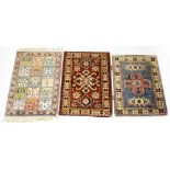 A small Persian silk rug with floral motifs within squares in floral border,
