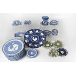 WEDGWOOD; a collection of fourteen blue jasperware Christmas plates, various years from 1969,
