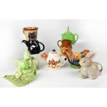 A group of vintage collectible teapots of various form, to include a mid-20th century rooster,