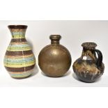 A West German pottery vase with flared rim and bulbous form with bands of maroon, pink,