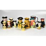 A collection of eleven Toby and character jugs, plus one other, various designs and makes (12).
