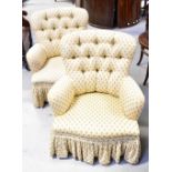 A pair of mid-20th century tub chairs with button backs upholstered in a woven cream material with
