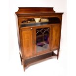 An Edwardian mahogany inlaid display cabinet, stepped frieze above single shelf with mirror back,