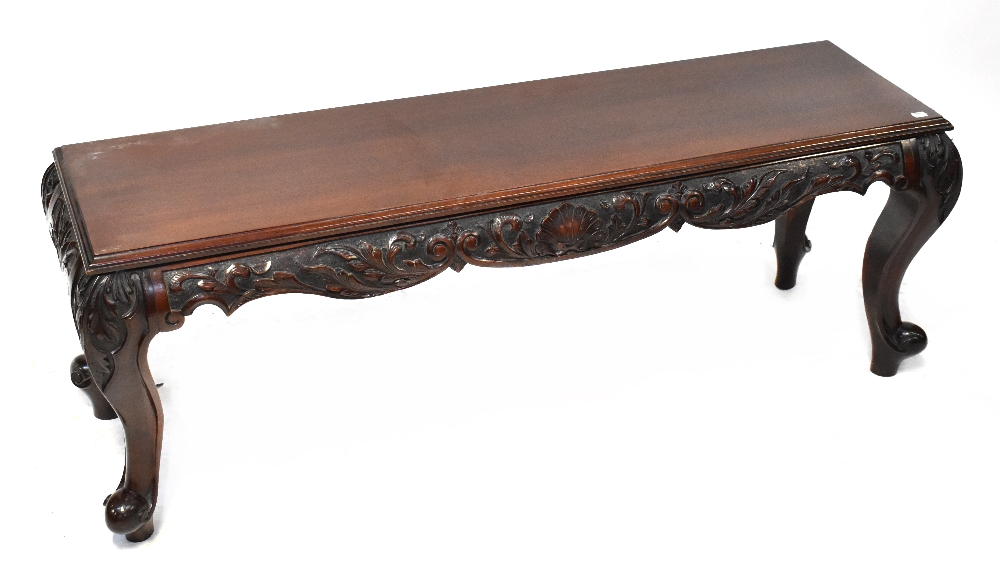 A late 19th/early 20th century window seat/bench, to carved cabriole supports, height 51cm,