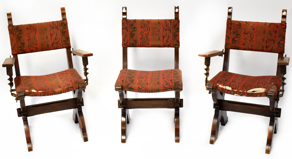 A mid-20th century oak Jacobean-style dining table with slab end supports and six matching dining