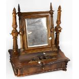A late 19th century walnut Continental swing frame toilet mirror, with rectangular bevelled plate,
