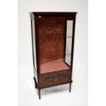 A 20th century mahogany inlaid and floral painted display unit,