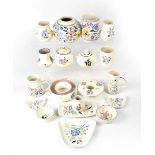 POOLE; a group of nineteen ceramics in the early 20th century traditional floral patterns,