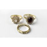 Three 9ct gold dress rings, one with large blue stone within a halo of white stones,