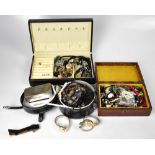 A quantity of costume jewellery in three jewellery boxes, to include assorted beads,