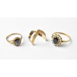 Three 9ct gold rings, to include a wishbone example, size K/L,