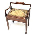 An Edwardian-style mahogany inlaid piano stool with shallow back rest and curved arms,