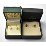 Two pairs of 9ct gold earrings to include a pair of rosette studs and a pair of cultured pearl