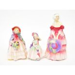 ROYAL DOULTON; three porcelain figures to include HN1642 'Granny's Shawl',
