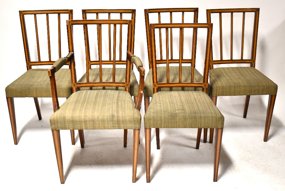A set of six Edwardian satinwood inlaid stick back dining chairs with stuffover seats and tapering