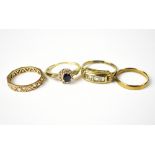 Four yellow metal rings with various marks, one marked 9ct, one marked 333,