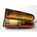 A Edward VII hallmarked silver collared, amber and bone cigar/cheroot holder,