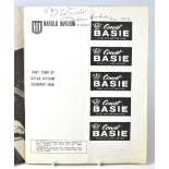 COUNT BASIE & HIS ORCHESTRA; a programme bearing several signatures of Count Basie and the band.