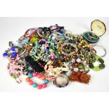 A large quantity of costume jewellery to include necklaces, bracelets, diamanté jewellery, brooches,