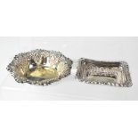 Two Victorian hallmarked silver dishes, a rectangular example with scrolling repoussé border,