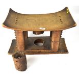 A 19th century African tribal wooden headrest, the curved top supported on four corner pillars,