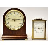 A modern Woodford battery-operated mahogany dome shaped mantel clock,