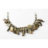 A vintage silver charm bracelet comprising mostly silver threepence coins and nursery rhyme and