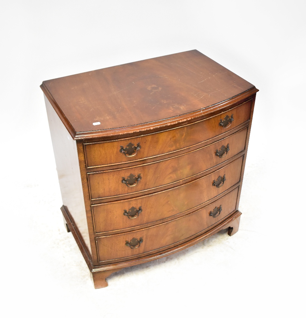 An early 20th century mahogany bow-fronted chest of four graduated drawers, raised on bracket feet,