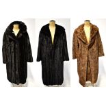 Two vintage fur coats comprising a circa 1960s caramel full-length fur with fold-back reveres,