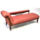 A Victorian mahogany framed chaise longue, the back with turned supports single scroll end,