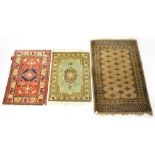 A small Caucasian brown ground rug with diamond motifs within multi-borders, 132 x 80cm,