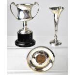 Three items of hallmarked silver to include a small twin-handled trophy on stand, height 8cm,