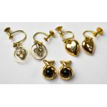 Three pairs of 9ct gold earrings to include a pair of heart-shaped drops with centred white stone