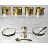 A set of four George V hallmarked silver napkin rings of plain design, Arthur James Lawrence,