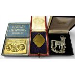 Three dog and animal-related collectibles comprising a 'Societé Canine du Languedoc' bronze plaque,