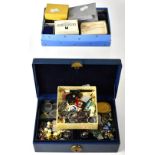 A vintage blue leather jewellery box containing a quantity of mainly vintage costume jewellery to