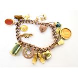 A 9ct rose gold link bracelet with eleven 9ct gold charms, cameo, Saint Christopher medal, tug,