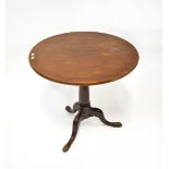 A 19th century mahogany circular tilt-top table with birdcage action,