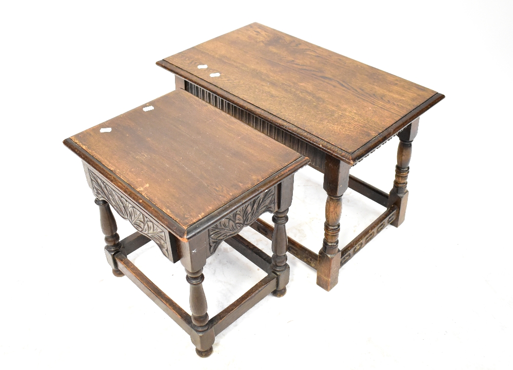 An early 20th century small oak drop-leaf occasional table with turned and stretchered supports,