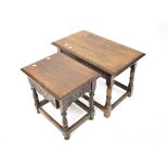 An early 20th century small oak drop-leaf occasional table with turned and stretchered supports,