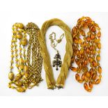 An Italian glass beaded necklace with cased gold foil, a honey amber-style necklace,
