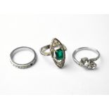 Three fashion rings comprising one with two large kissing white stones,
